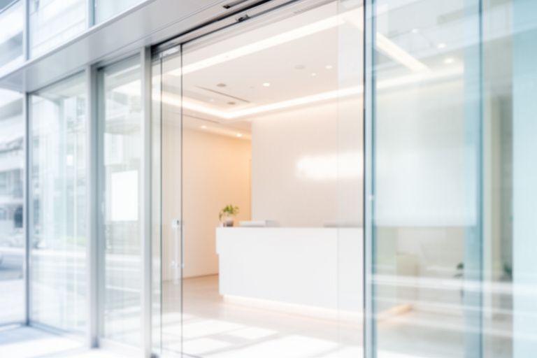 Bright office entrance with modern support signage and a clean reception desk in New York